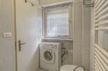 This charming bathroom features a practical layout with essential amenities.
