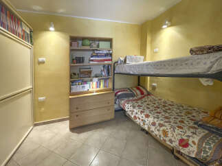 This cozy bedroom features a bunk bed, perfect for maximizing space.
