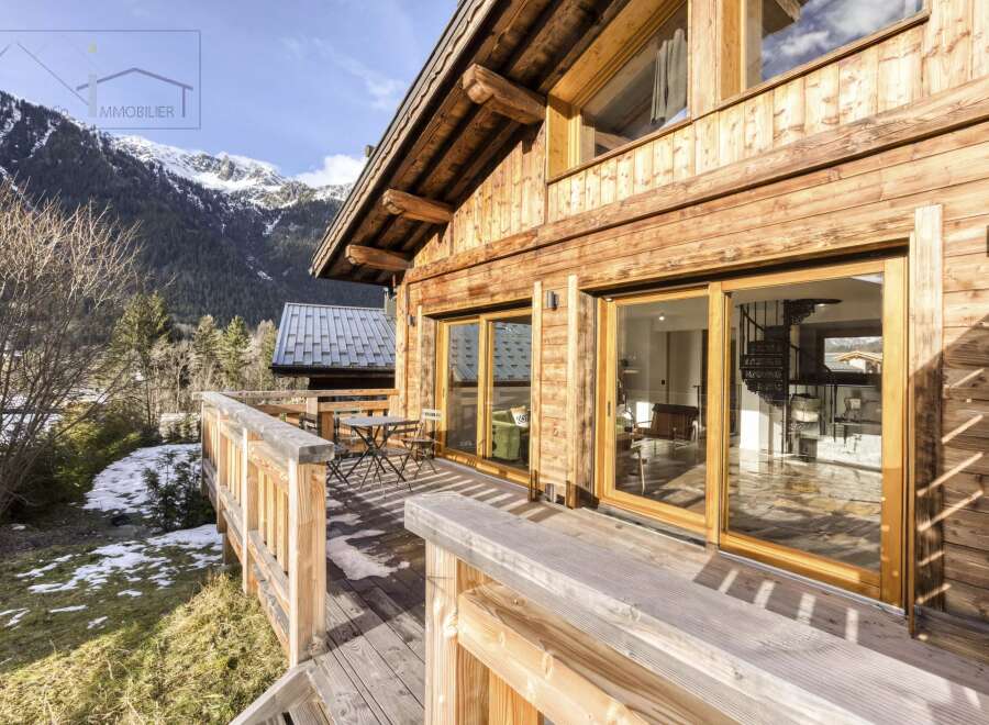 Experience the charm of this stunning wooden chalet nestled in a picturesque mountain setting.