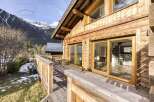 Experience the charm of this stunning wooden chalet nestled in a picturesque mountain setting.