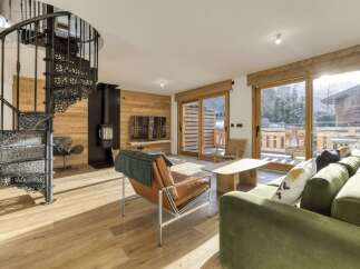 Step into luxury with this stunning property featuring a unique spiral staircase and a cozy fireplace.