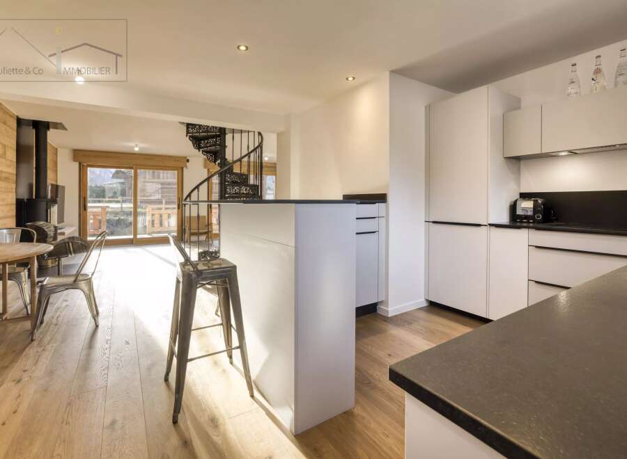 Discover the epitome of modern living in this stunning property, featuring a sleek kitchen with a stylish island and contemporary appliances.