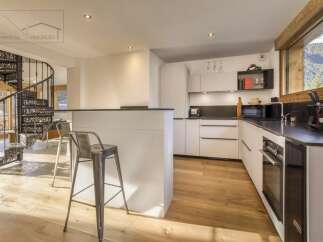 This stunning kitchen boasts modern design and functionality, perfect for culinary enthusiasts.