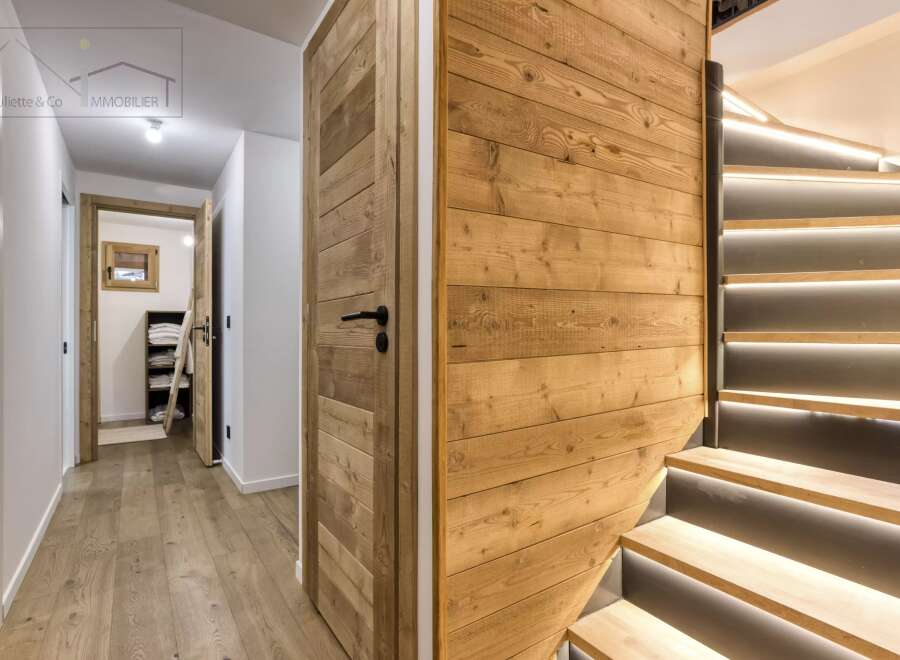 This stunning property boasts a modern interior with a warm, inviting ambiance.