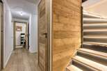 This stunning property boasts a modern interior with a warm, inviting ambiance.
