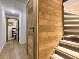 This stunning property boasts a modern interior with a warm, inviting ambiance.