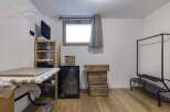 Discover the potential of this versatile space, perfect for a home office or a cozy retreat.