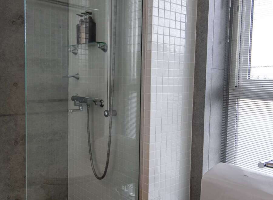 Step into a modern bathroom oasis with this stunning property.