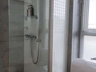 Step into a modern bathroom oasis with this stunning property.