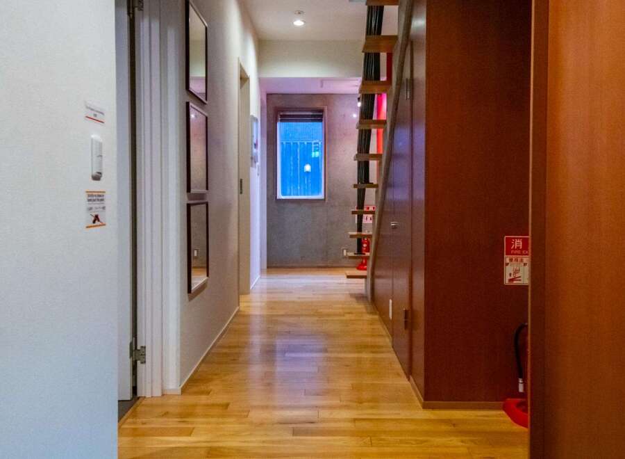 Step into this inviting property featuring a warm, wooden floor that extends throughout the hallway.