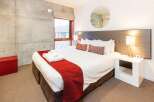 Experience modern comfort in this stylish bedroom.