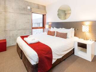 Experience modern comfort in this stylish bedroom.
