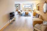 Experience luxury living in this stunning property! This home boasts a bright and airy living space with beautiful hardwood floors and large windows offering breathtaking views.