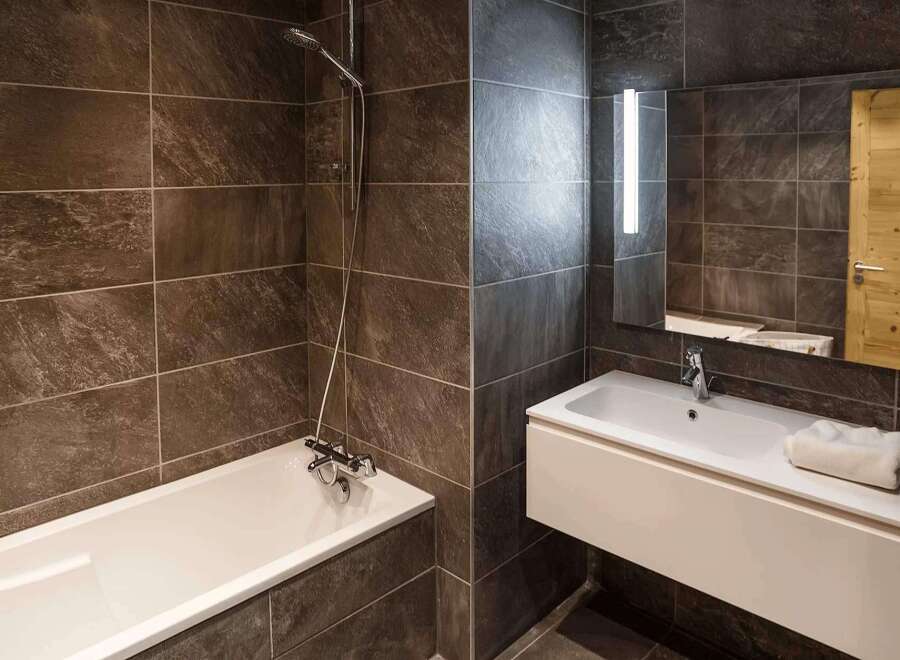 Step into a modern bathroom oasis, featuring sleek design and luxurious finishes.