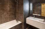 Step into a modern bathroom oasis, featuring sleek design and luxurious finishes.