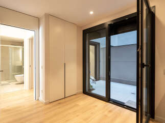 Discover modern living in this stylish property! Featuring a bright and airy interior with sleek hardwood floors, this home offers a seamless blend of comfort and elegance.