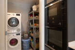 Discover the convenience of this property, featuring a dedicated laundry area with a washer and dryer.