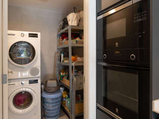 Discover the convenience of this property, featuring a dedicated laundry area with a washer and dryer.
