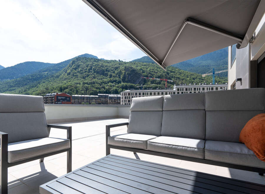 Enjoy breathtaking mountain views from this stunning outdoor living space.