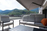 Enjoy breathtaking mountain views from this stunning outdoor living space.