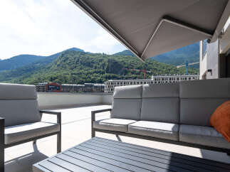 Enjoy breathtaking mountain views from this stunning outdoor living space.
