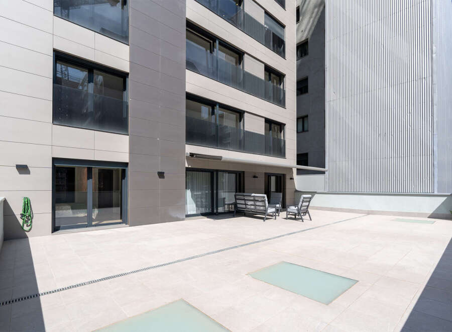 Discover modern living at its finest with this stunning property featuring a spacious outdoor terrace.