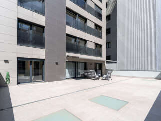 Discover modern living at its finest with this stunning property featuring a spacious outdoor terrace.