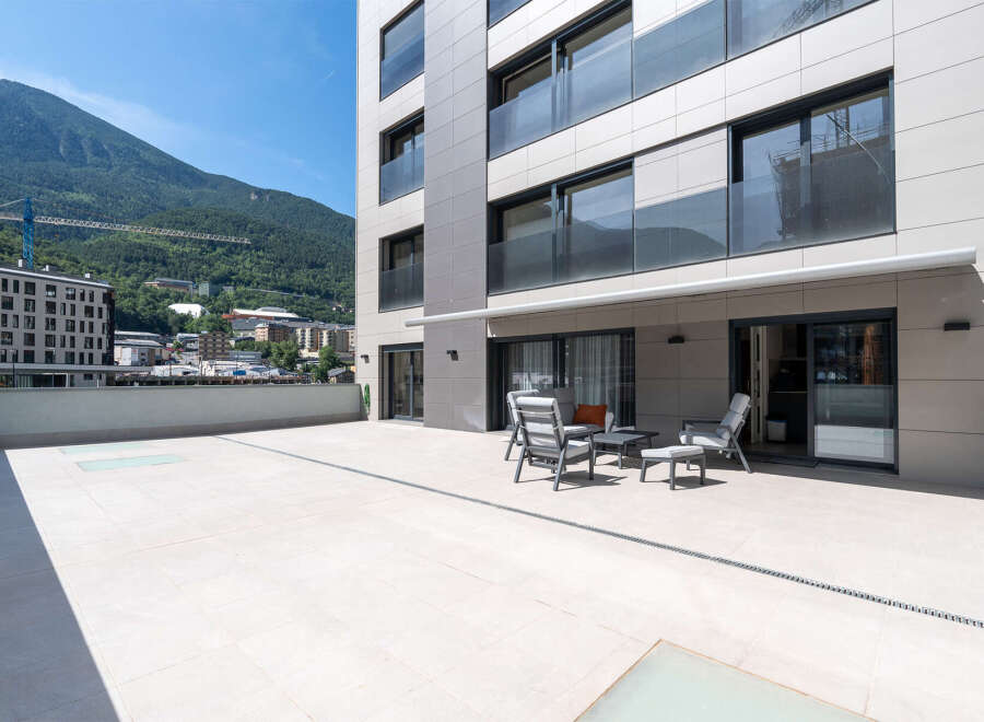 Enjoy breathtaking mountain views from this modern property featuring a spacious terrace.