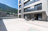 Enjoy breathtaking mountain views from this modern property featuring a spacious terrace.