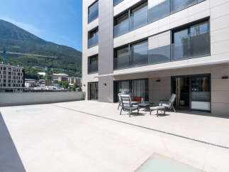 Enjoy breathtaking mountain views from this modern property featuring a spacious terrace.