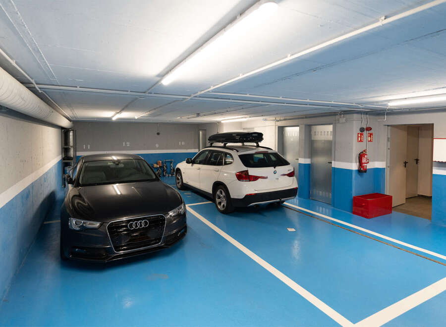 This modern parking garage offers secure and convenient parking for residents.