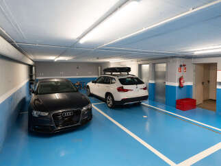 This modern parking garage offers secure and convenient parking for residents.