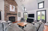 Experience luxury living in this stunning property! Featuring a cozy fireplace, a spacious living area, and large windows that offer natural light.