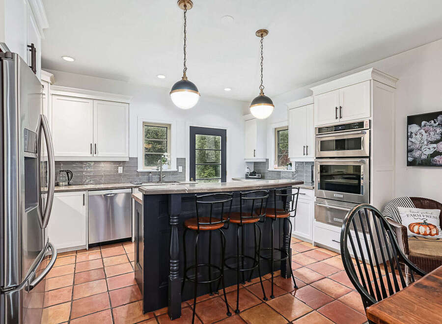 Step into this stunning kitchen, a perfect blend of modern design and inviting warmth.