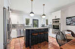 Step into this stunning kitchen, a perfect blend of modern design and inviting warmth.