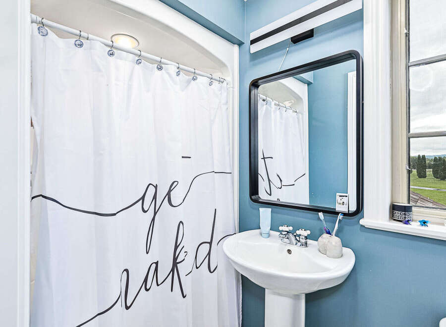 This charming bathroom features a modern design with a touch of elegance.