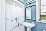 This charming bathroom features a modern design with a touch of elegance.