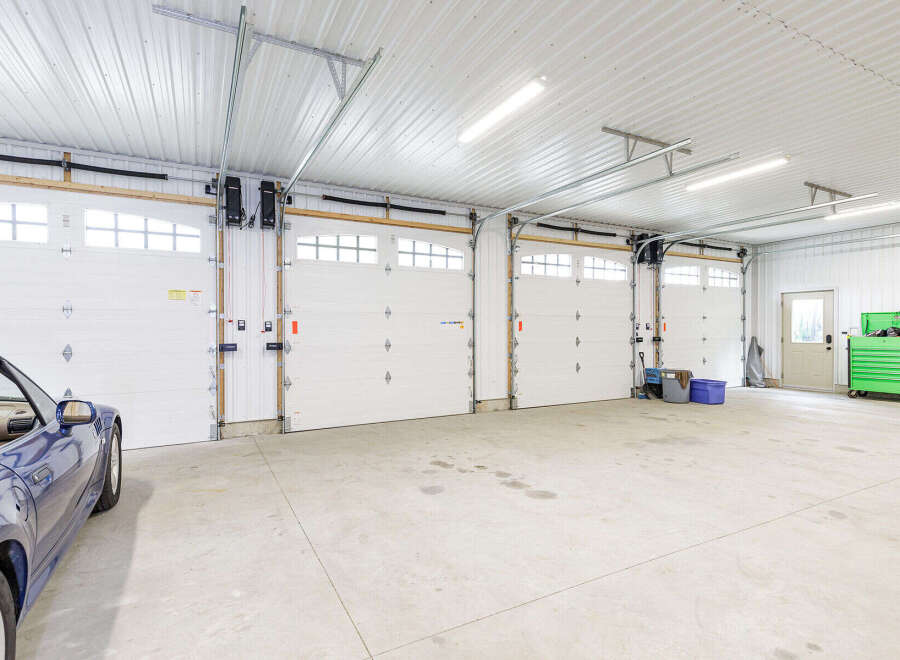 This spacious garage offers ample room for vehicles and storage.