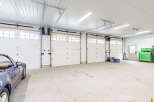 This spacious garage offers ample room for vehicles and storage.