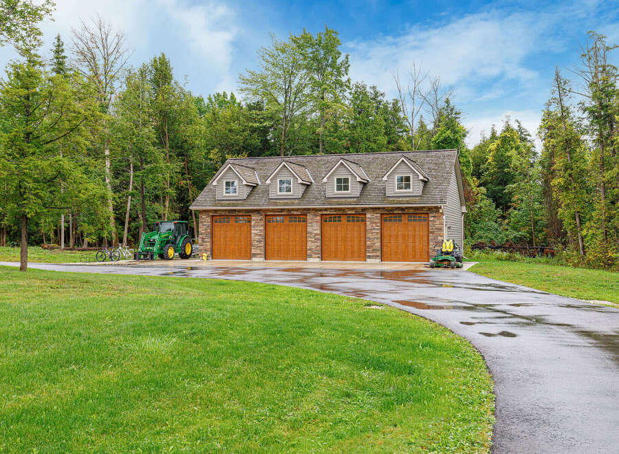 This stunning property features a spacious four-car garage, perfect for storing vehicles and equipment.