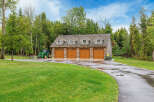 This stunning property features a spacious four-car garage, perfect for storing vehicles and equipment.