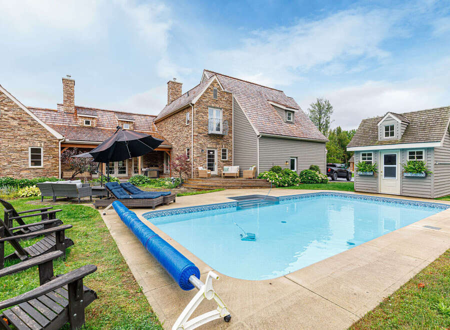 This stunning property boasts a luxurious outdoor oasis, perfect for relaxation and entertainment.