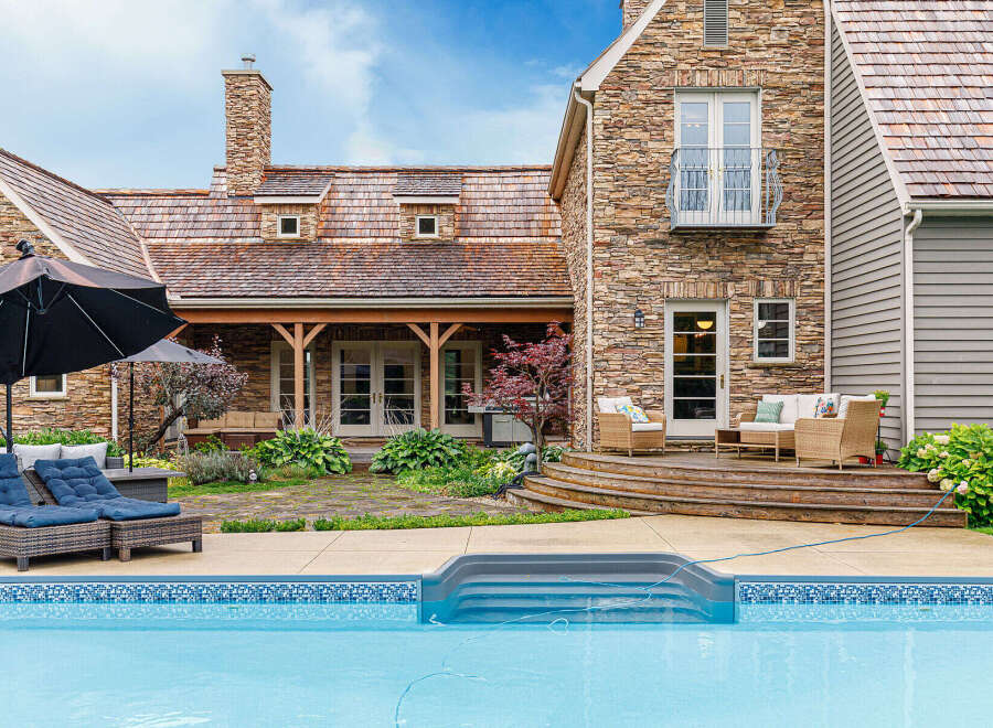This stunning property boasts a luxurious outdoor oasis, perfect for relaxation and entertaining.