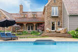 This stunning property boasts a luxurious outdoor oasis, perfect for relaxation and entertaining.