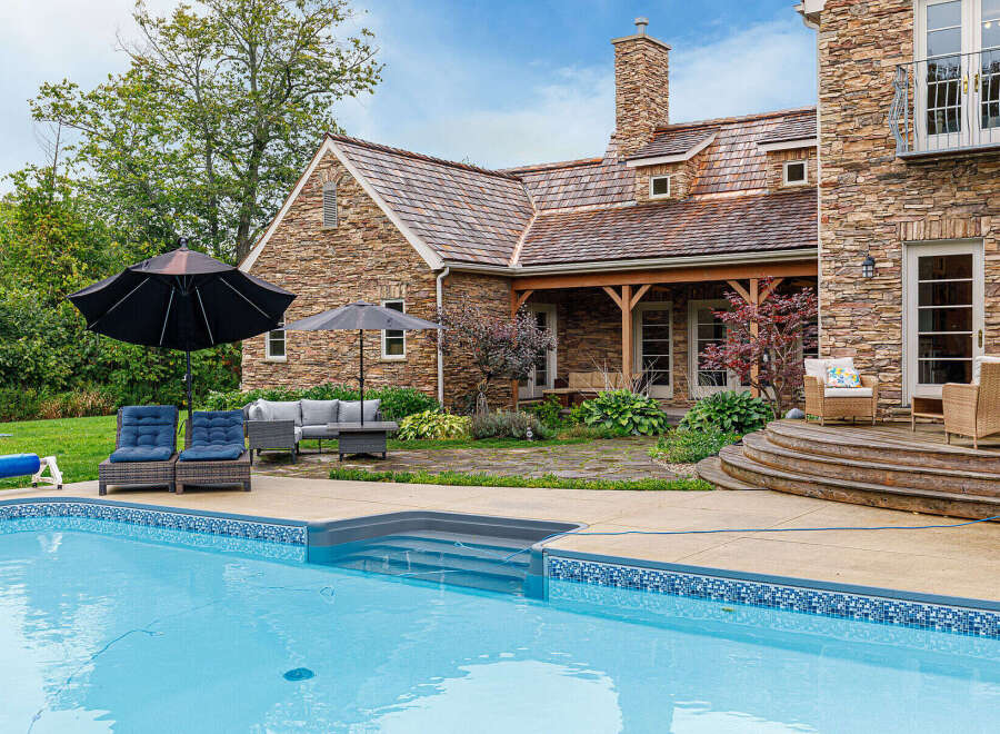 This stunning property boasts a luxurious outdoor oasis, perfect for relaxation and entertainment.