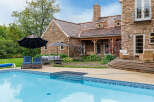 This stunning property boasts a luxurious outdoor oasis, perfect for relaxation and entertainment.