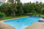 Enjoy the tranquility of this stunning property featuring a sparkling swimming pool, perfect for relaxation and entertainment.