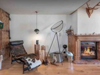 Step into luxury with this stunning property, featuring a cozy fireplace perfect for chilly evenings.