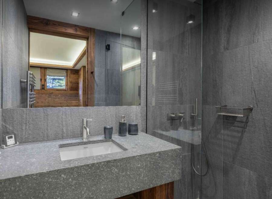 Experience luxury in this stunning bathroom featuring a sleek, modern design.