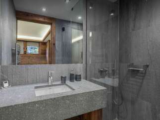 Experience luxury in this stunning bathroom featuring a sleek, modern design.